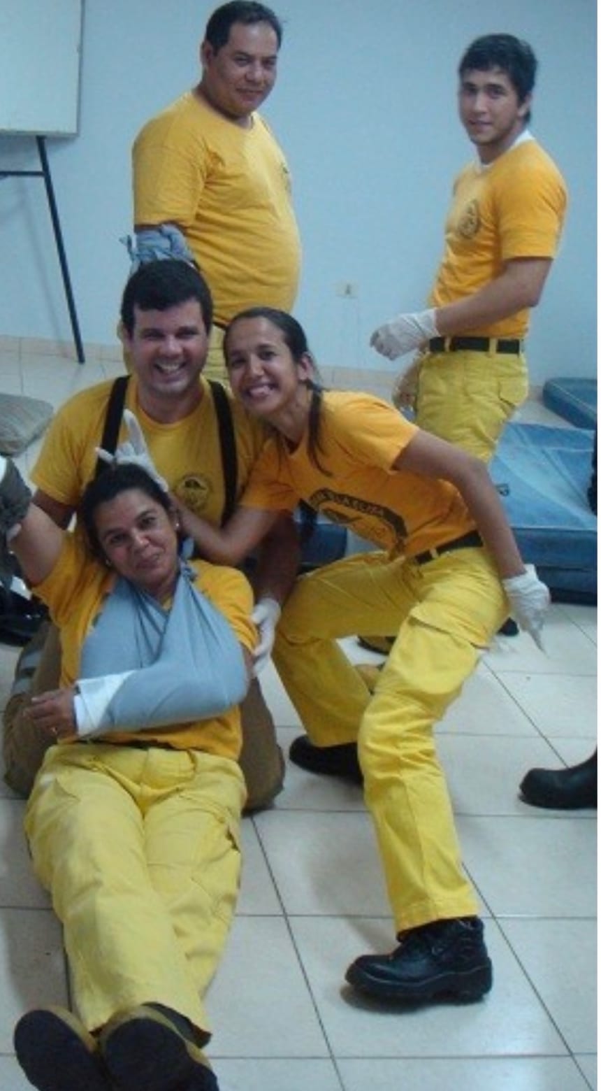 Firefighters and rescue crew smiling together after a first aid class